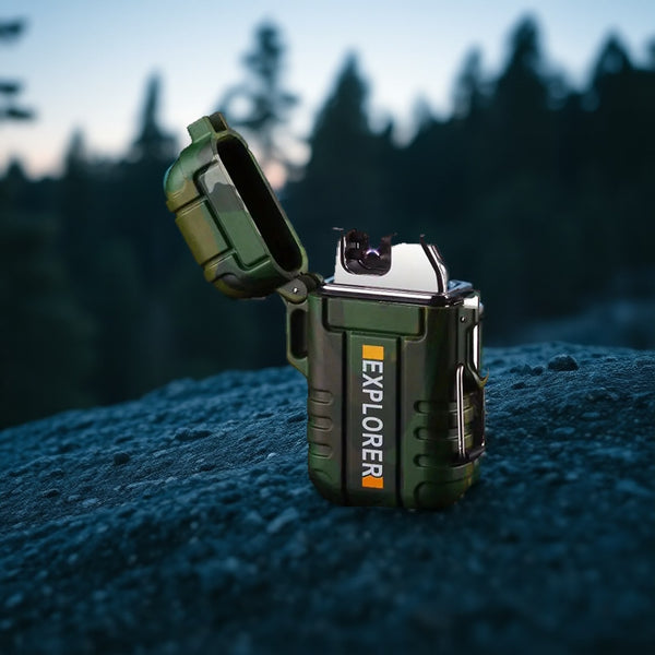 Camo green waterproof arc lighter with its lid open on a granite boulder at dusk