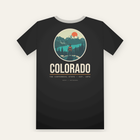 Black tee, back print: a hiker above a turquoise lake and snowy peaks in a circle, COLORADO below