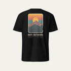 Black tee photographed from the back, showing the full sunset mountain print