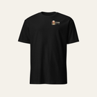 Black tee photographed from the front: small arch badge and Zion on the left chest