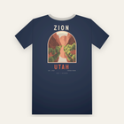 Navy tee, back print: a red rock canyon and river inside an arch, ZION above, UTAH below